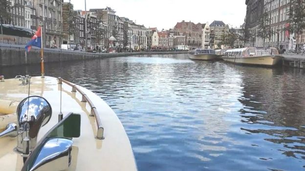 How Amsterdam’s canal boats are going electric – at a cost
