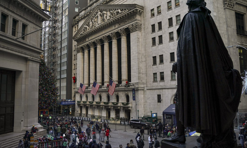 Stocks end mostly lower but log first weekly gain in a turbulent December