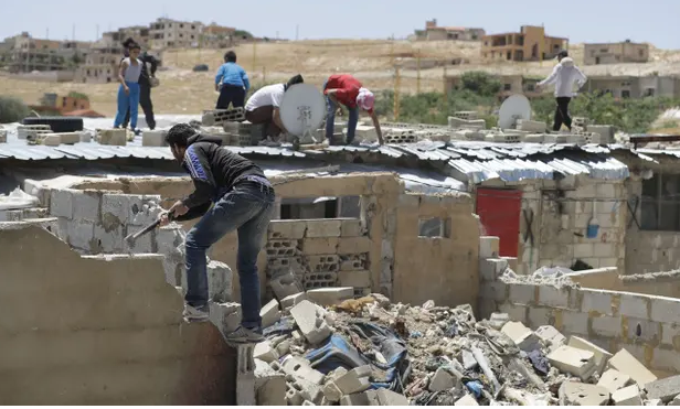 Syrian refugees forced to destroy their own homes in Lebanon