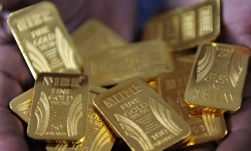 Gold prices top $1,800 an ounce to score highest finish since 2011