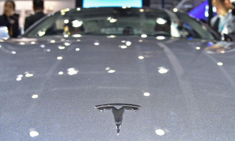 Tesla’s debt close to investment grade after S&P upgrade