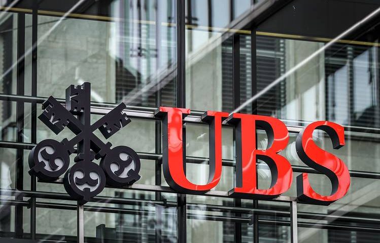 UBS upgrades Apple to buy on auto market hopes