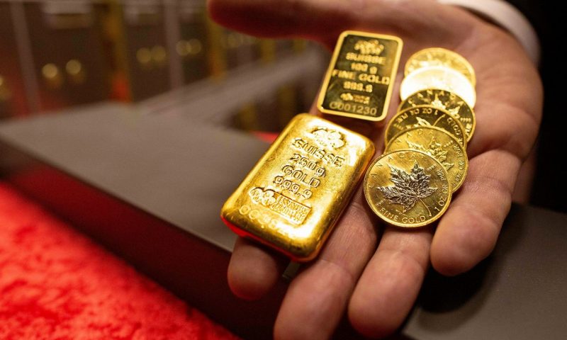 Gold prices finish lower as tech stocks rise, Turkish lira collapses