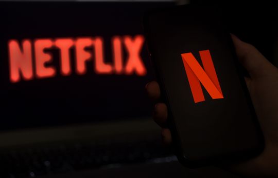 Dow ends 250 points higher, while Netflix plunge slams Nasdaq