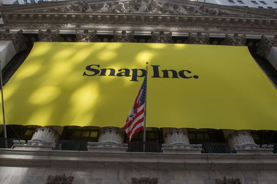 Dow ends with slight gain, as Nasdaq drops sharply in tech rout after Snap’s earnings warning