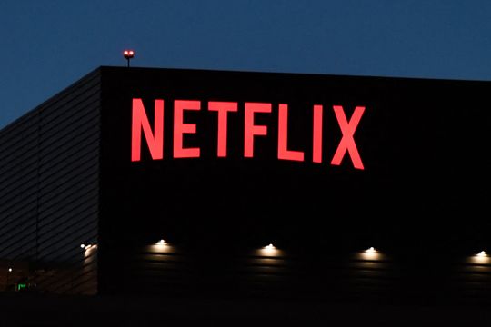 Netflix looks to cut costs, from cloud computing to corporate swag