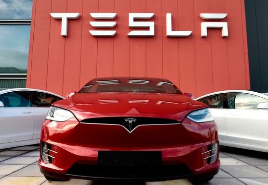 Tesla posts record quarterly profit amid challenges, offers sunny outlook