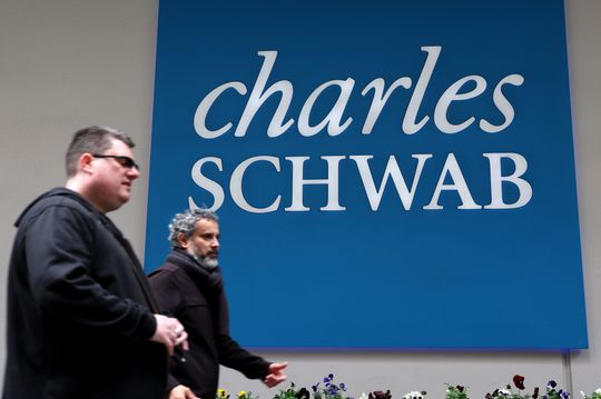 Schwab has reportedly laid off up to 2,000 employees; analyst reiterates outperform